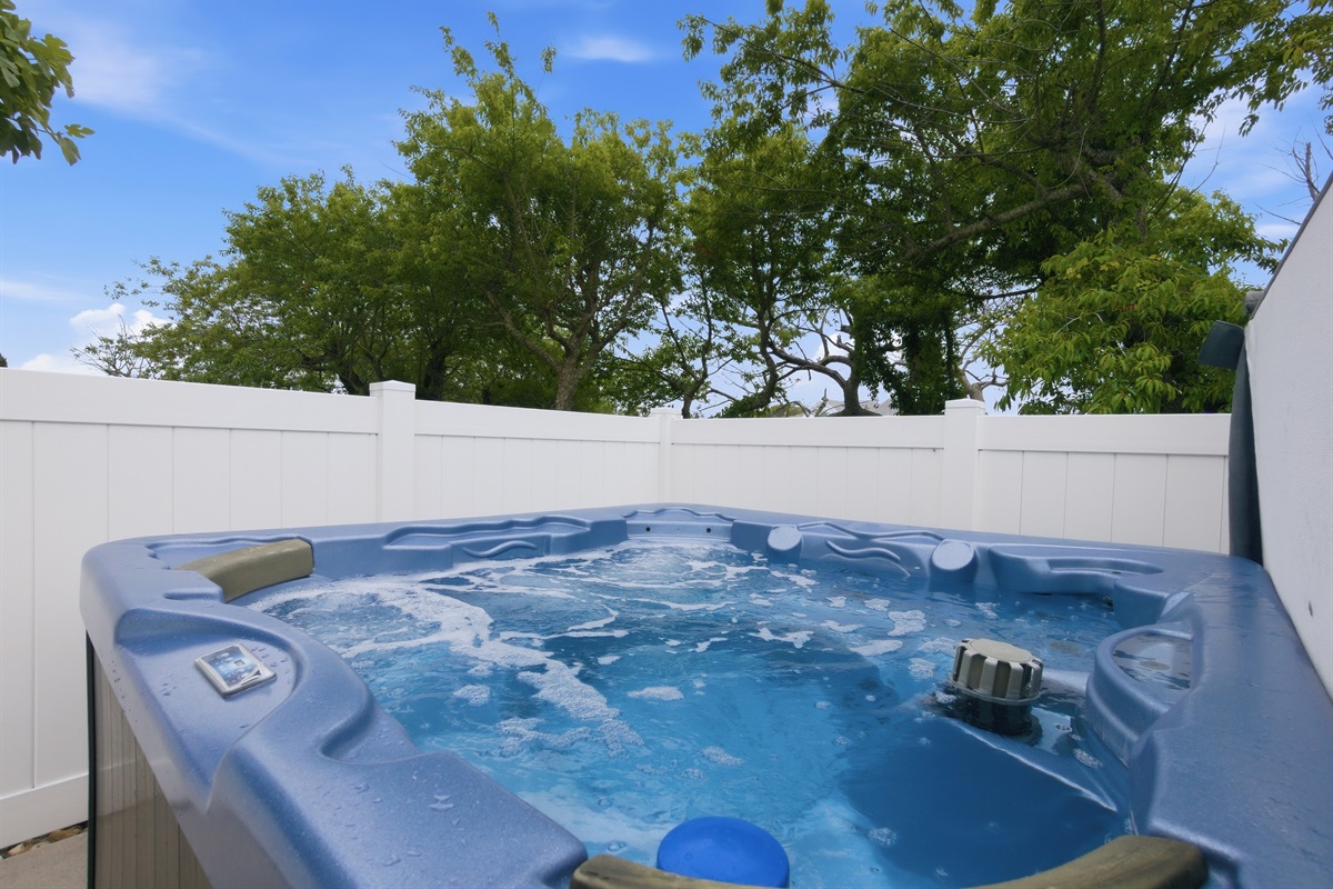 Private hot tub perfect for relaxing after a day at the beach.