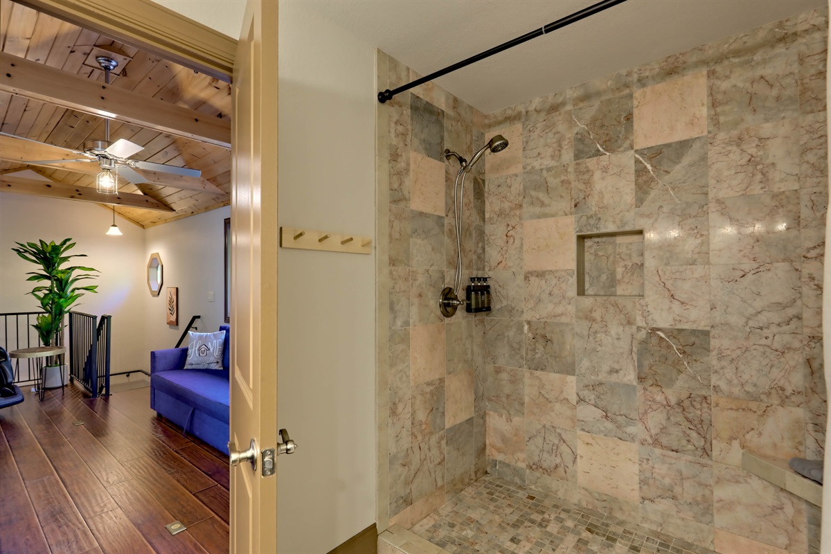 Beautiful tiled shower located on the second floor.