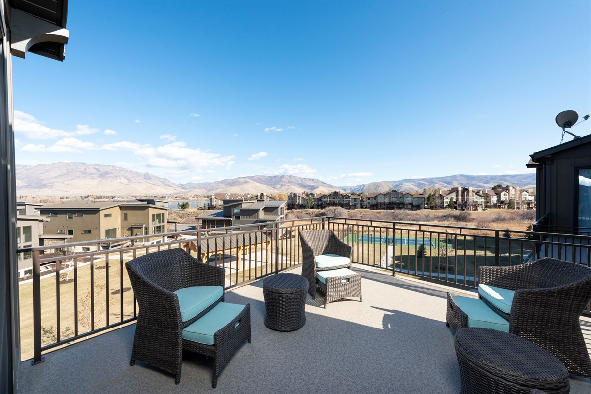 Private balcony off the bedrooms with panoramic valley and lake views