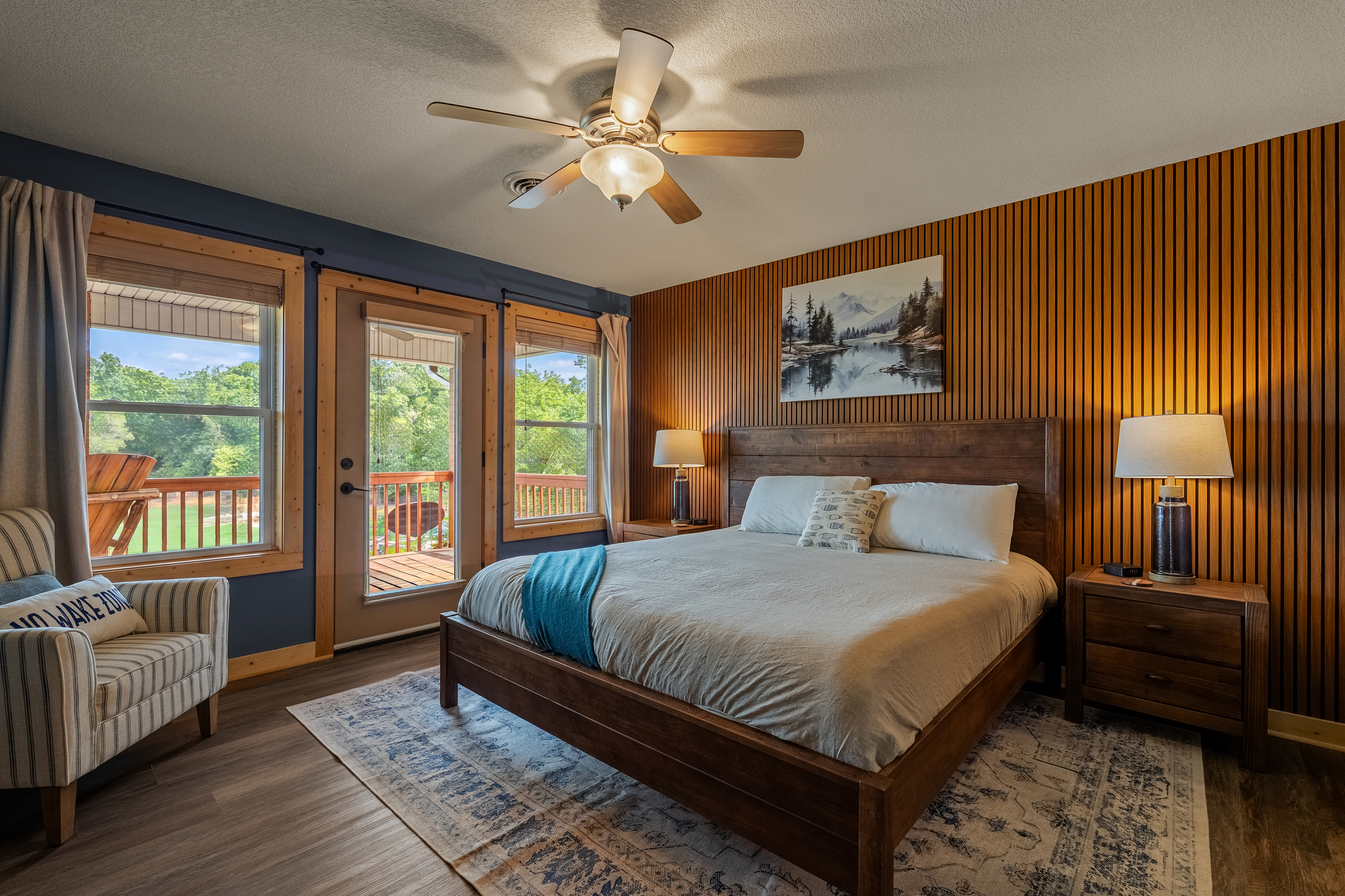 Large master with walk-out to deck and amazing lake views