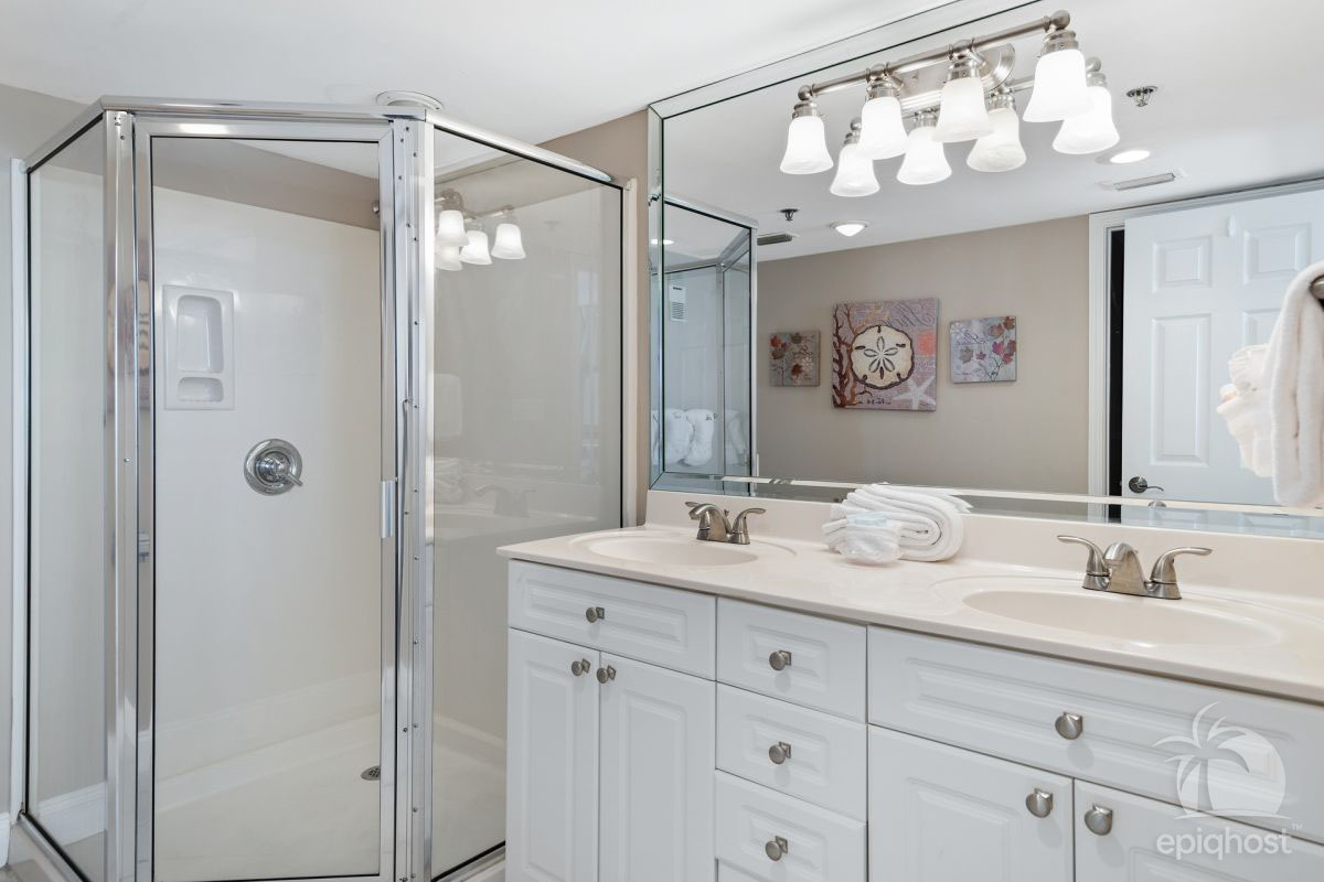 Master bath with double-sink vanity and walk-in shower