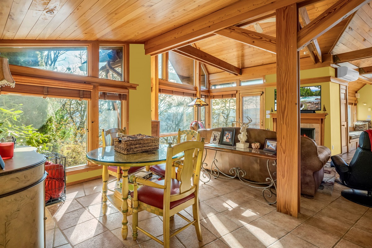 Open floor plan with natural light and floor to ceiling windows bring in the outdoors.
