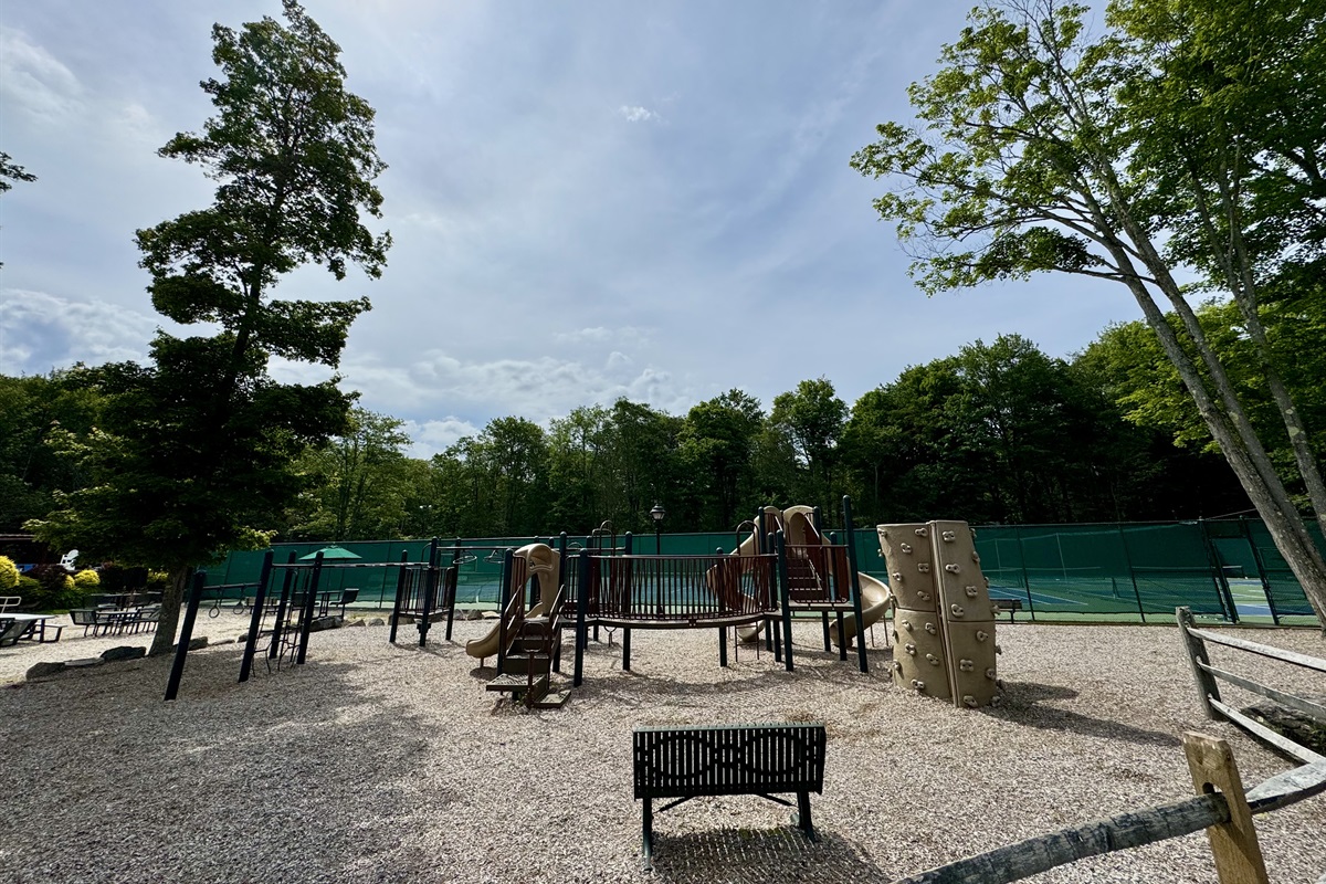 “Community playground with climbing wall — fun for little adventurers.”
