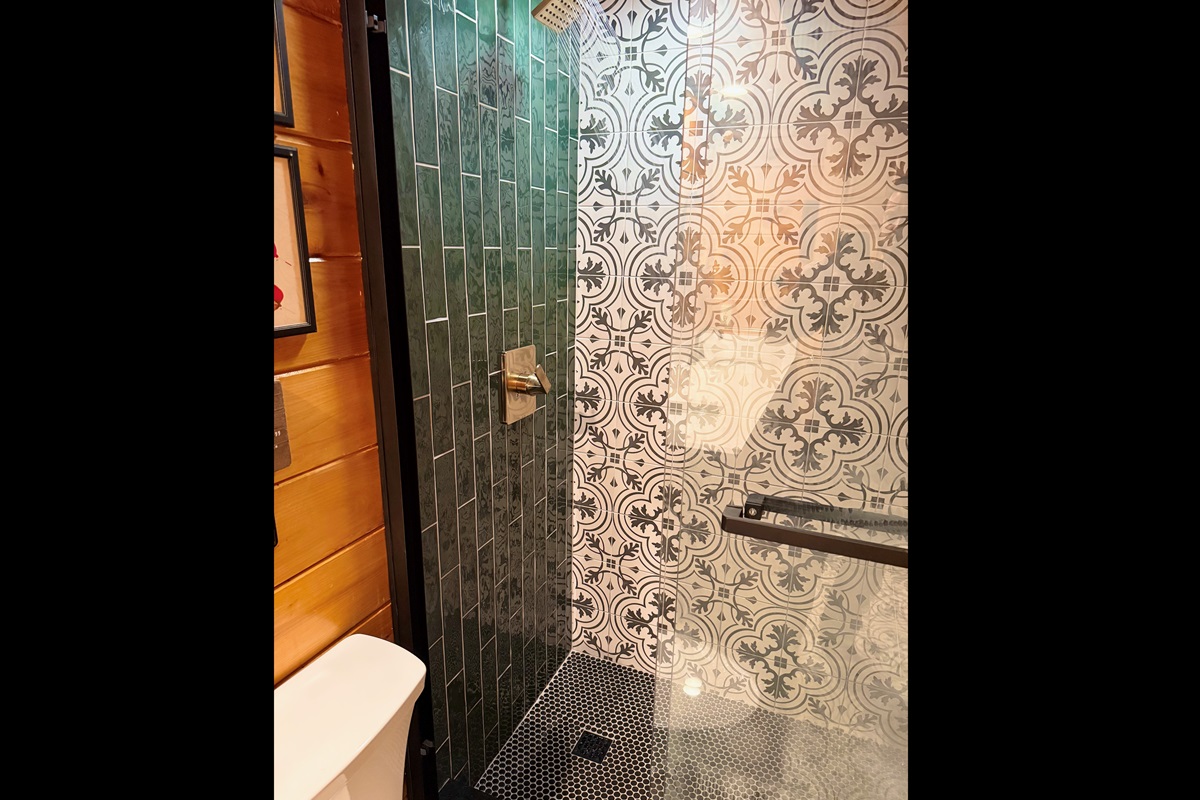 Shower in common bathroom on the main level