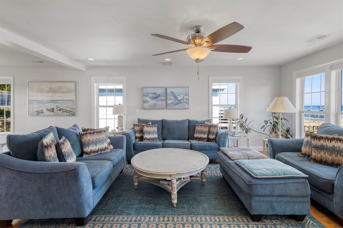 The living room has a large, pull out couch, chair and a half with ottoman, and loveseat.