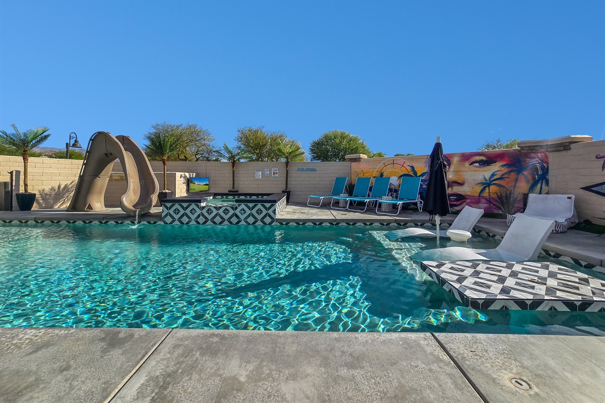 Poolside Paradise: Exciting waterslide to elevate your fun in the sun! 