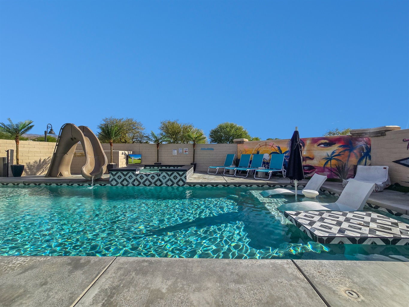 Poolside Paradise: Exciting waterslide to elevate your fun in the sun! 