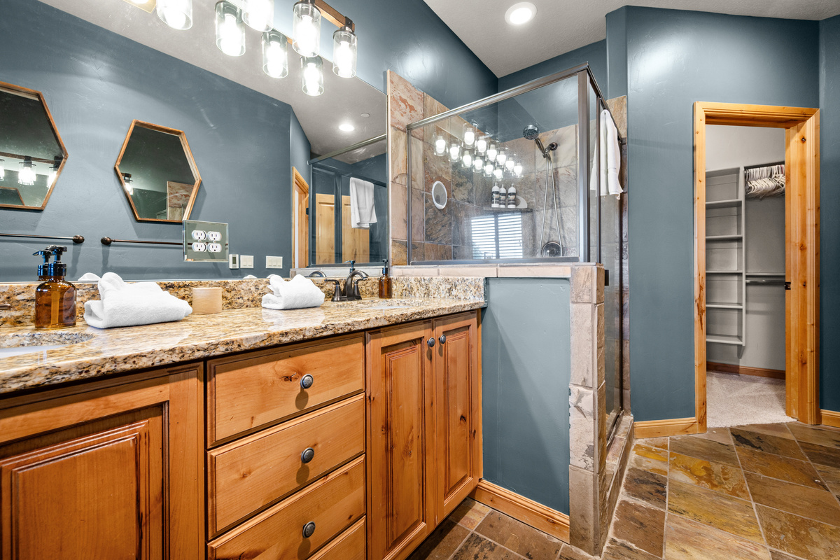 Spacious primary bathroom with double vanity, soaking tub, and walk-in shower.