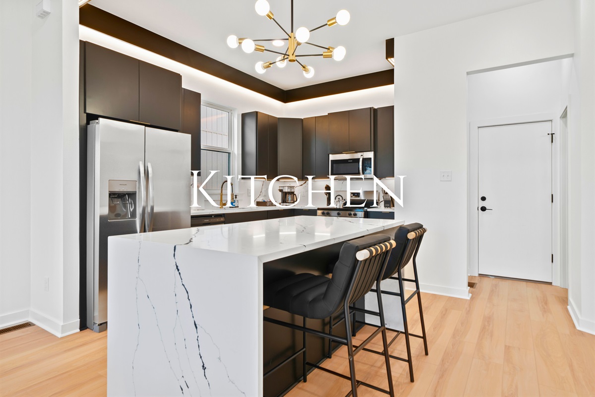 The kitchen is thoughtfully arranged for casual meals, light cooking, and spending time together.