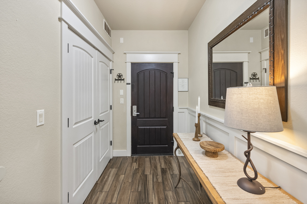 Convenient laundry closet near the entry with a full-size washer and dryer available for guest use.