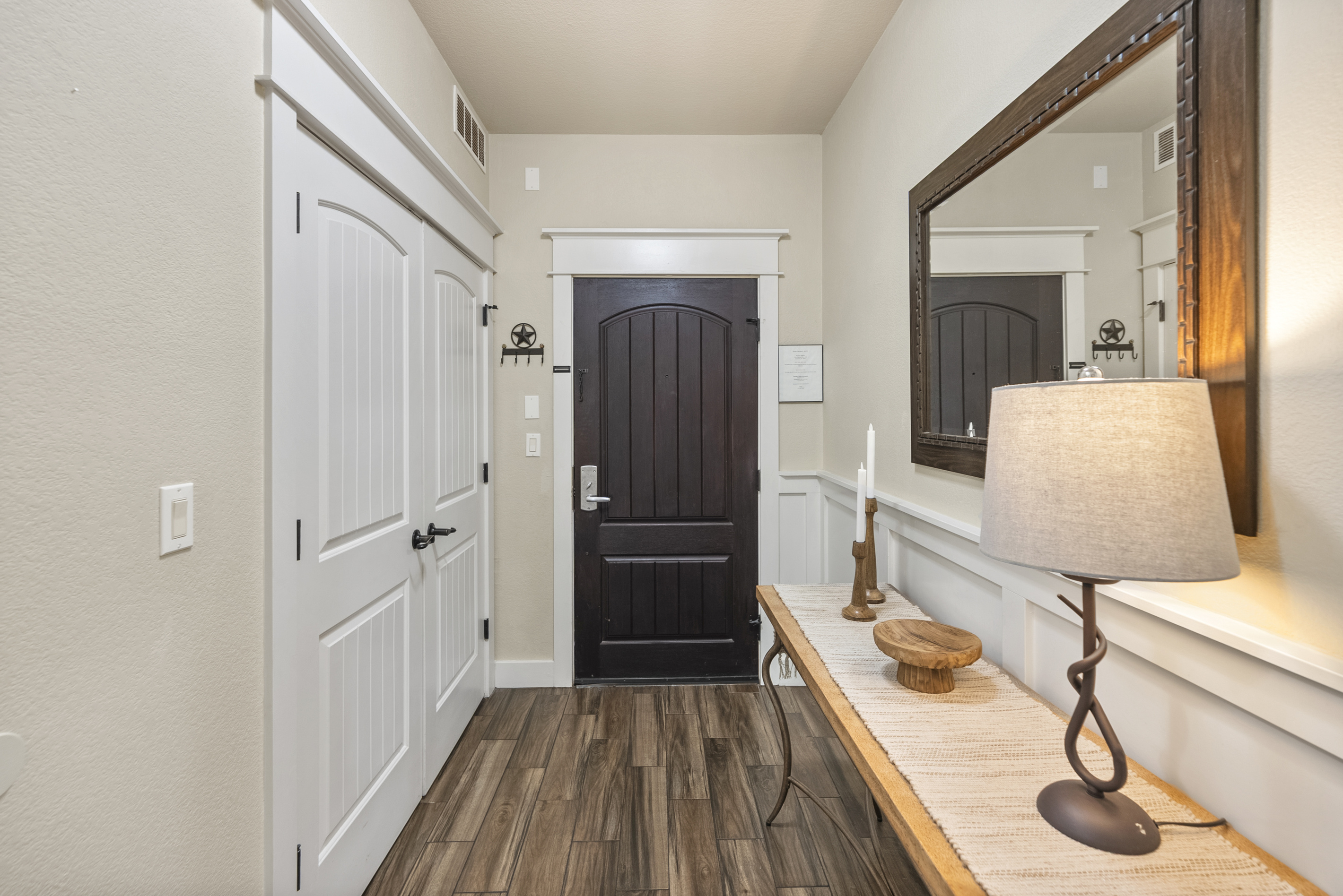 Convenient laundry closet near the entry with a full-size washer and dryer available for guest use.