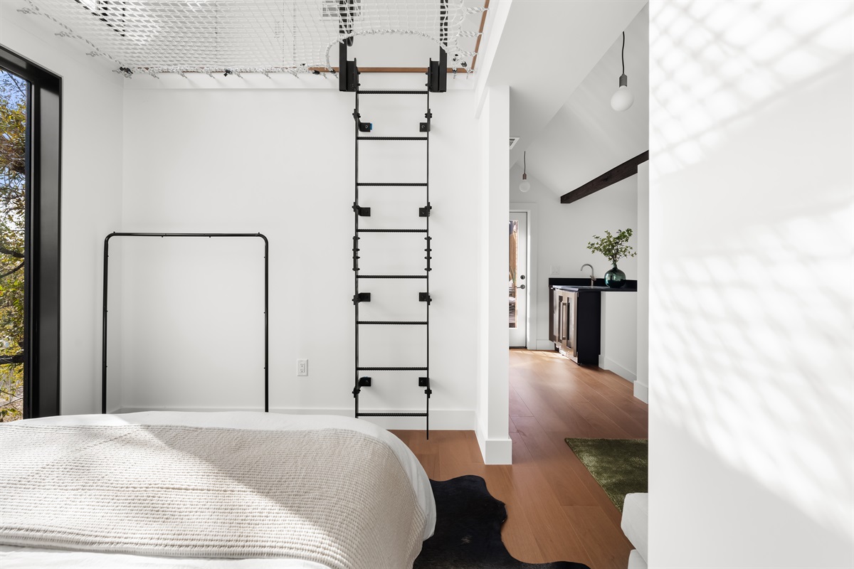 Bright and airy bedroom with unique architectural details and easy access to the rest of the home.