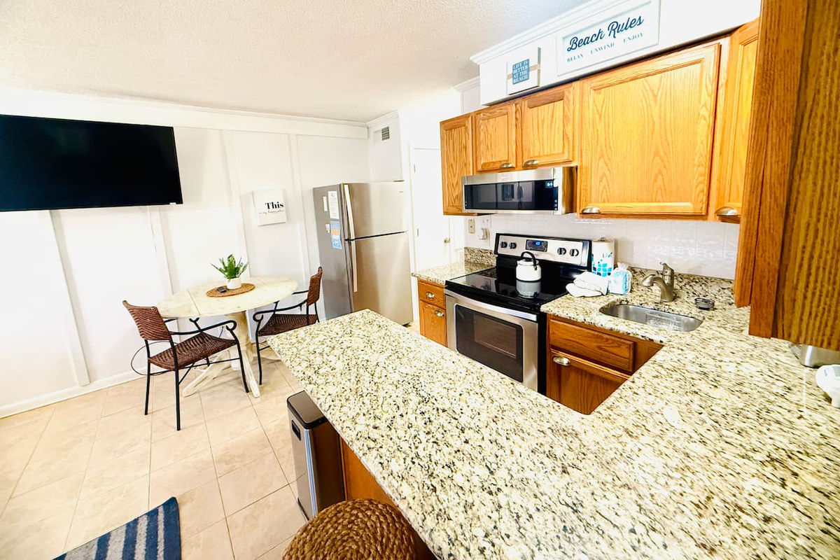 Kitchen with granite counters and breakfast bar