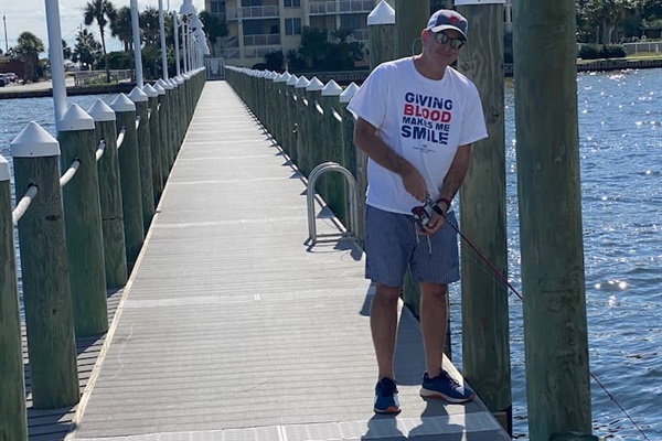 One of my best friends fishing from the bayside dock after a long morning of taking drone vidoes for us