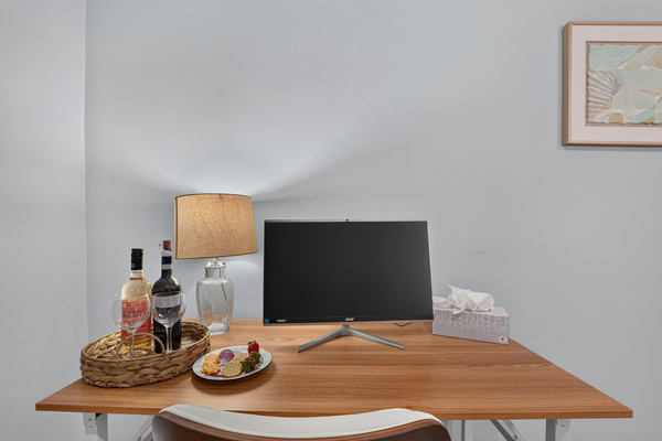 Dedicated workspace with a monitor, perfect for remote work or catching up on emails.