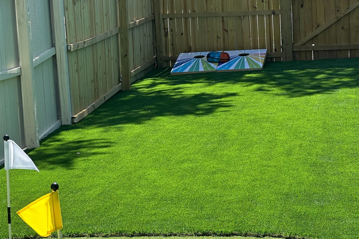 Refine your short game just steps from your door with a perfectly manicured artificial putting green, complete with flags. Whether you're warming up for the links or just having fun, it’s the ideal spot to unwind in the sun.
