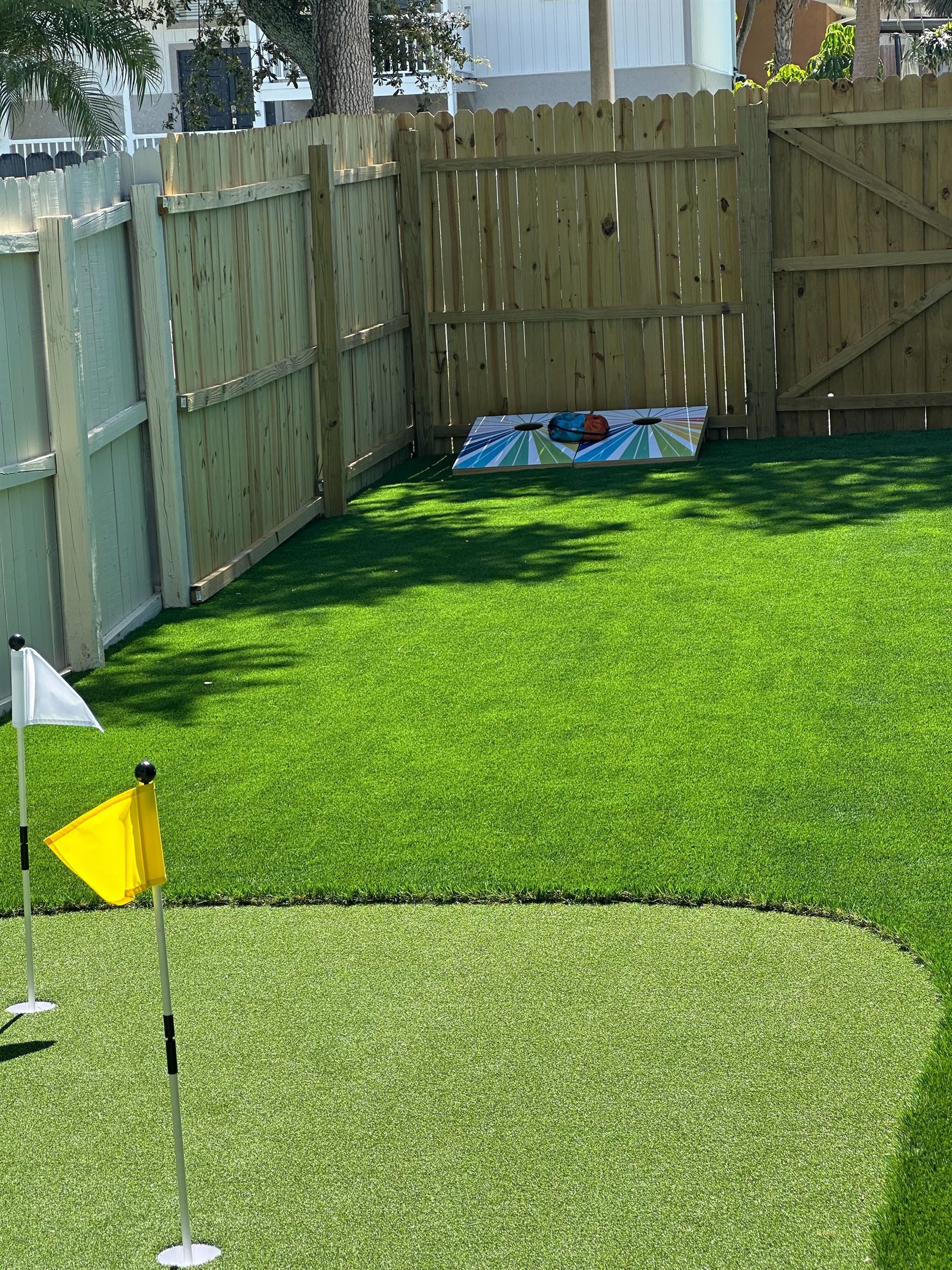 Refine your short game just steps from your door with a perfectly manicured artificial putting green, complete with flags. Whether you're warming up for the links or just having fun, it’s the ideal spot to unwind in the sun.