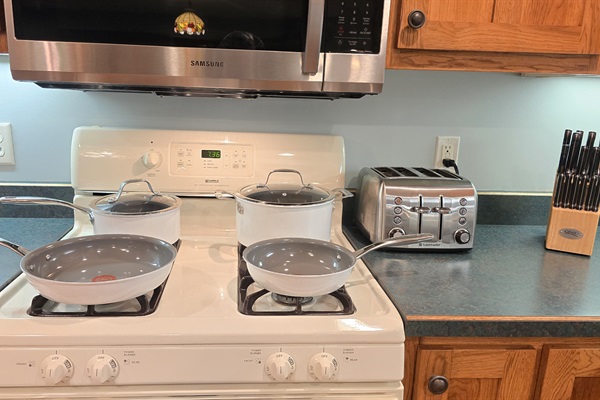Gas Stove with Pans, Toaster, and Knives