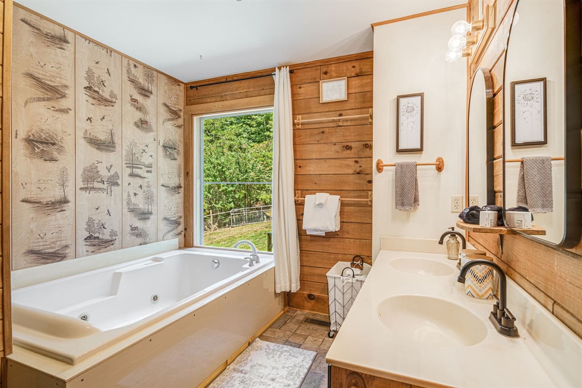 The main floor bath has a jetted jacuzzi tub.