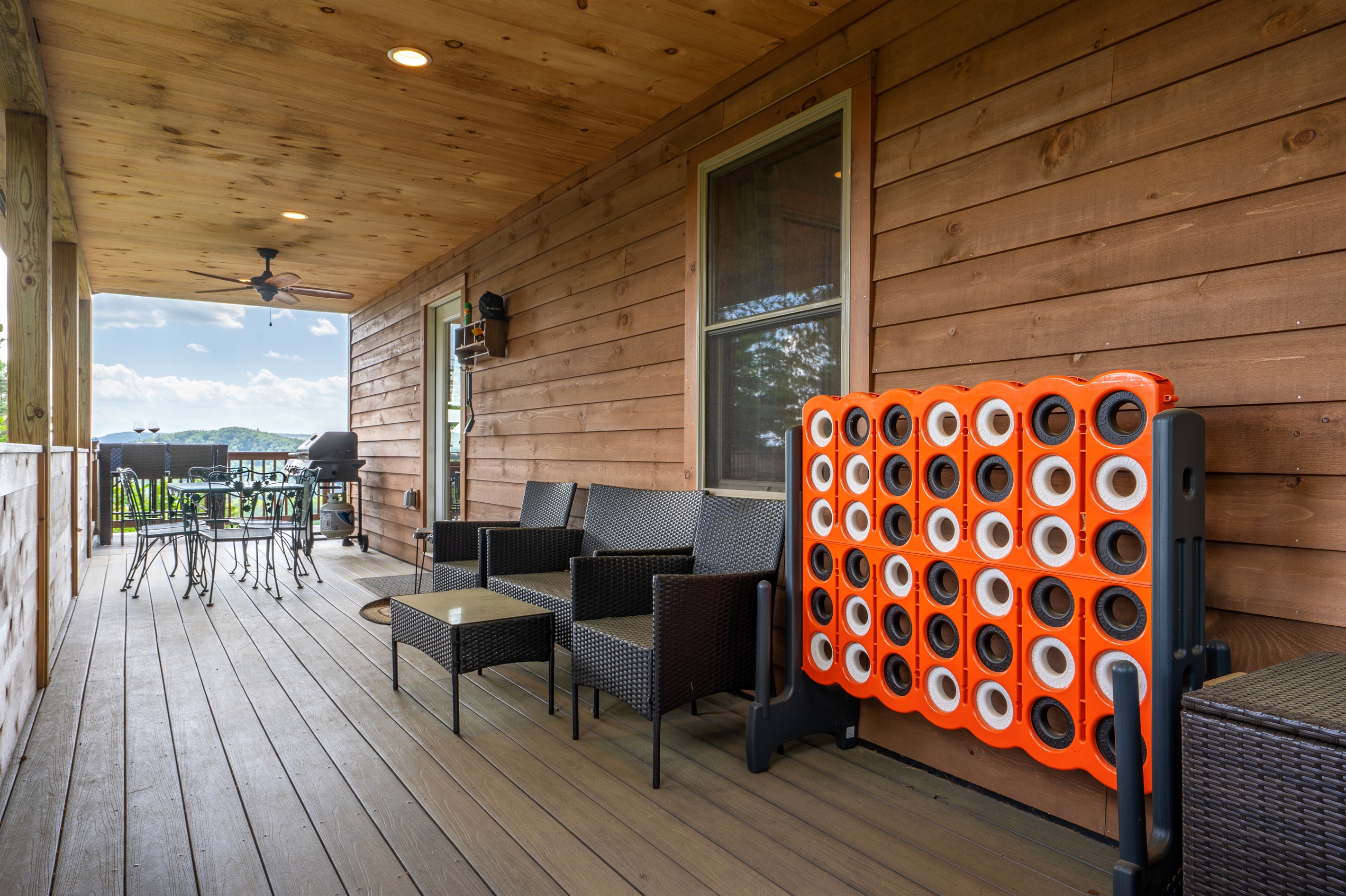 The deck features an outdoor dining area — perfect for sunset dinners or morning coffee."
