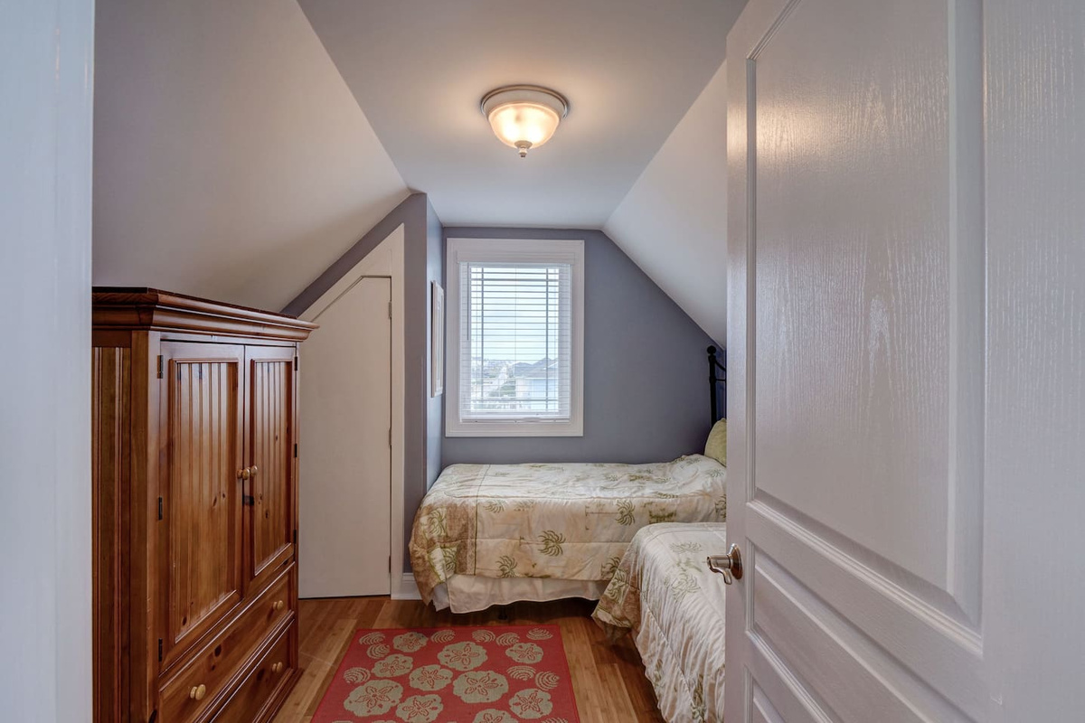 This bedroom can be found on the top level and shares Bathroom 3 with Bedroom 4