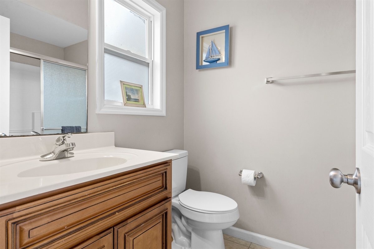 Bright bathroom vanity with clean finishes and storage