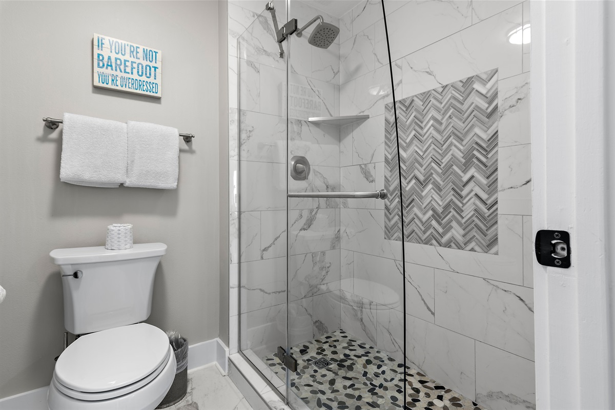 Primary bathroom is remodeled with dual vanity and luxurious, marble, walk in shower - a rare upgrade for condos in the building!