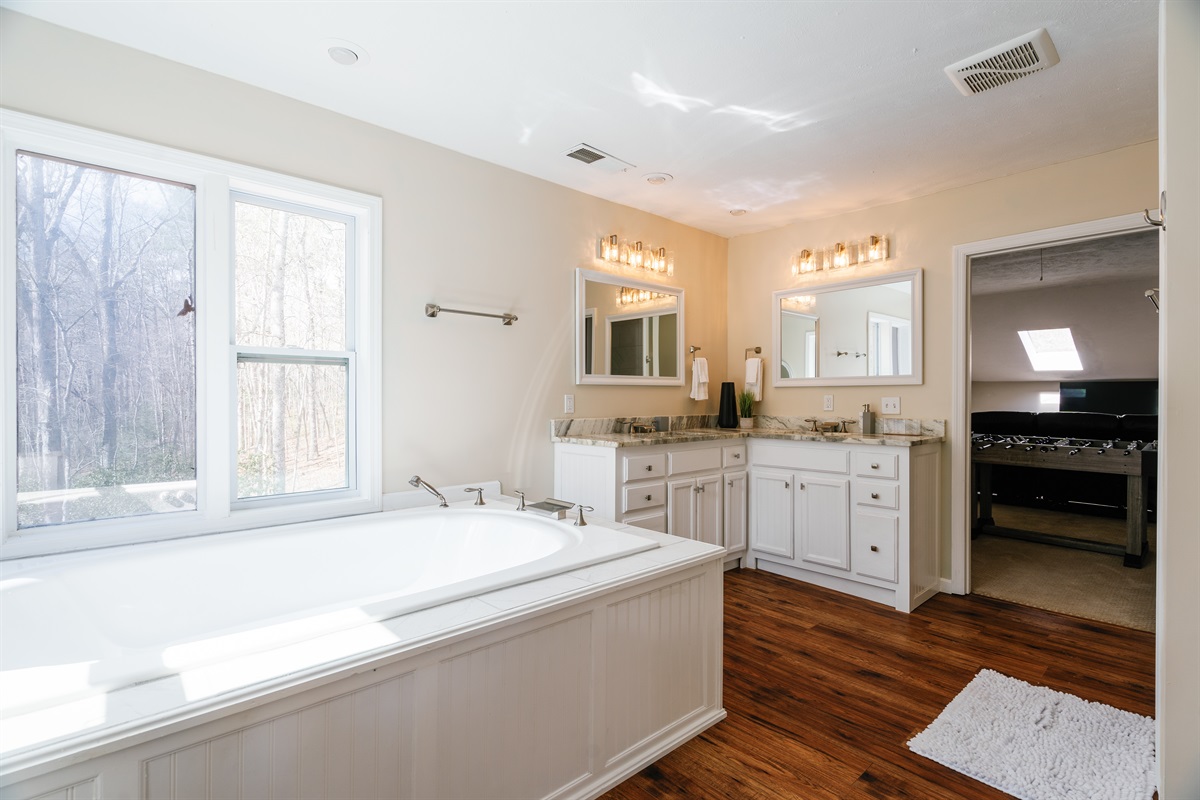 Master bedroom ensuite full bath with double vanities, jetted tub & shower