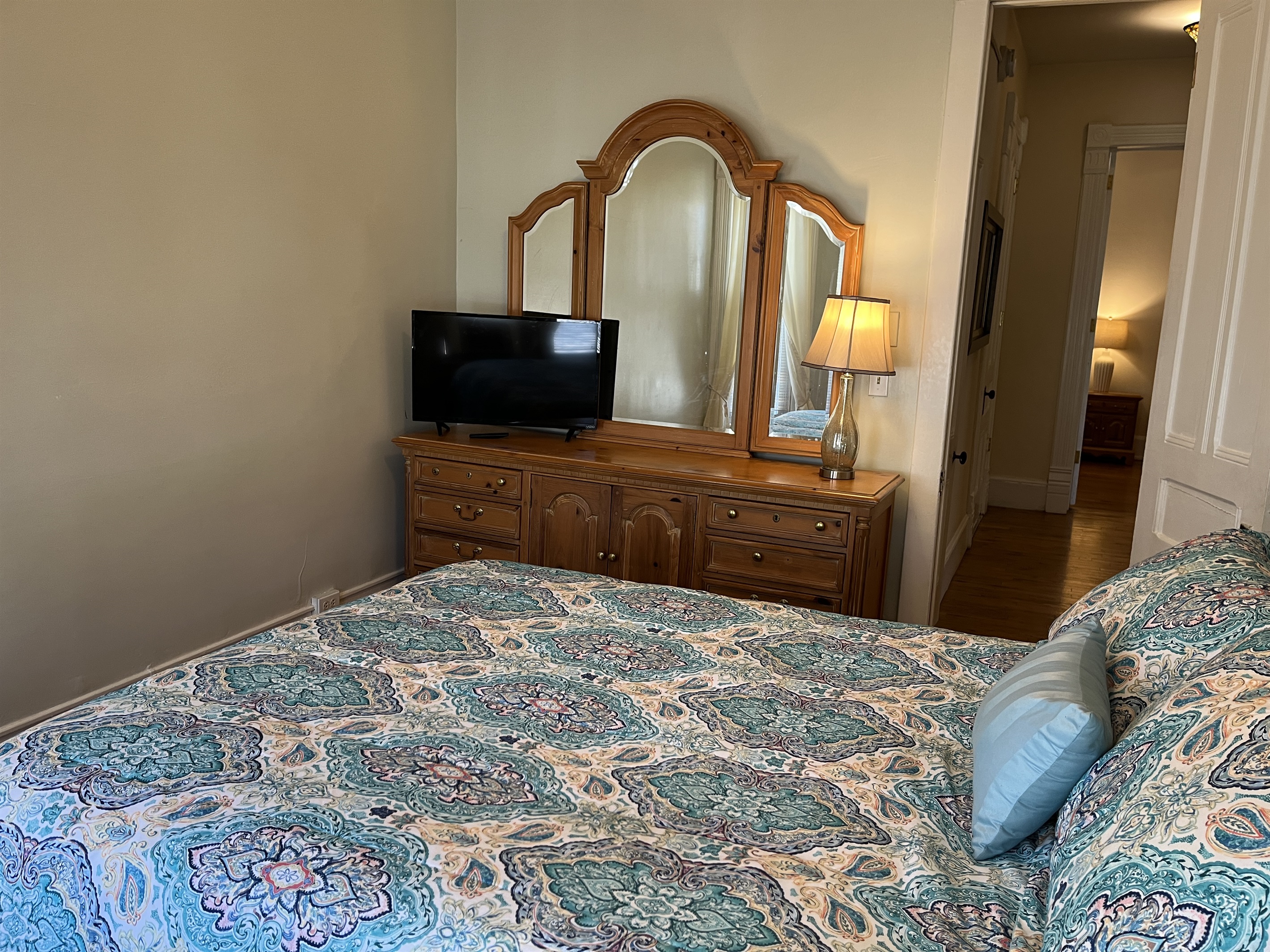 Queen bedroom #1 with hallway to bath room