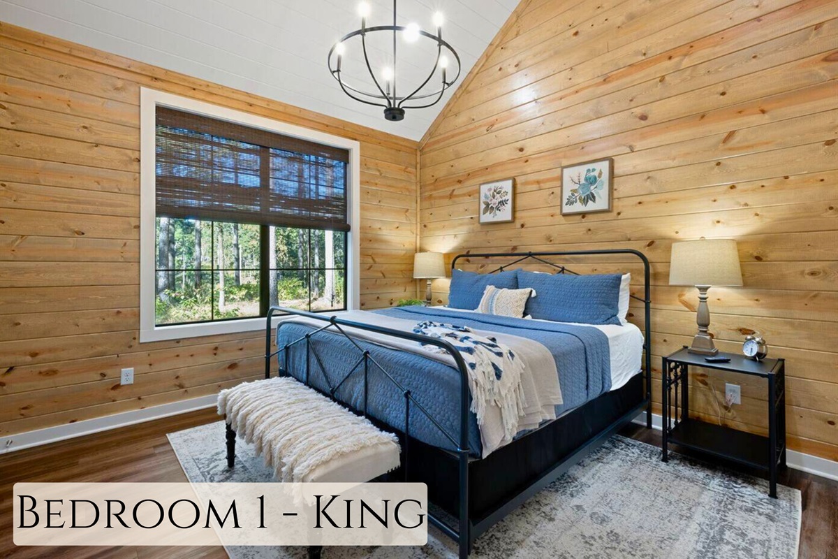 Awake in the king-sized bed to a room filled with soft morning light filtering through the trees.