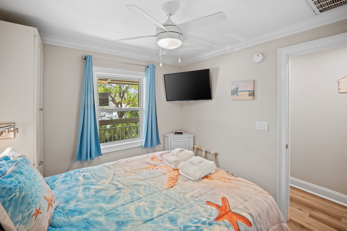 Bedroom with Built ins and reading lights at head of Bed w USB chargers, Roku smart tv spectrum cable