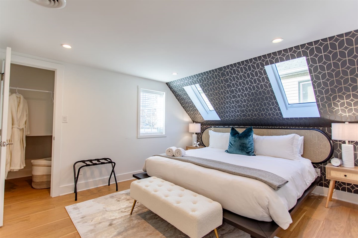 Cozy bedroom featuring an upper window, allowing natural light to flood the space while maintaining privacy and a serene atmosphere.