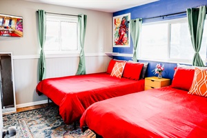 Group Getaway Headquarters – Our room is perfect for large gatherings, featuring two double-sized beds, ensuring ample space for groups to enjoy a memorable stay together!
