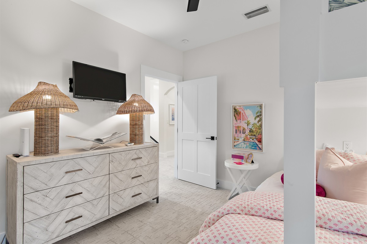 A large dresser and closet provide ample space for everyone's clothes.