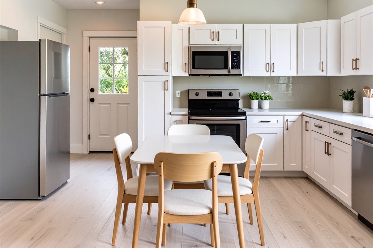 two dining tables, one seats for, the other 8 | digital preview of kitchen being renovated; final finishes may change