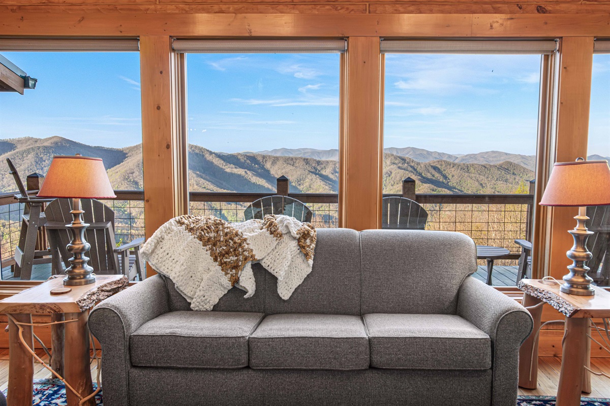 Living Room: Sweeping mountain views greet you as you relax on plush seating by the window!