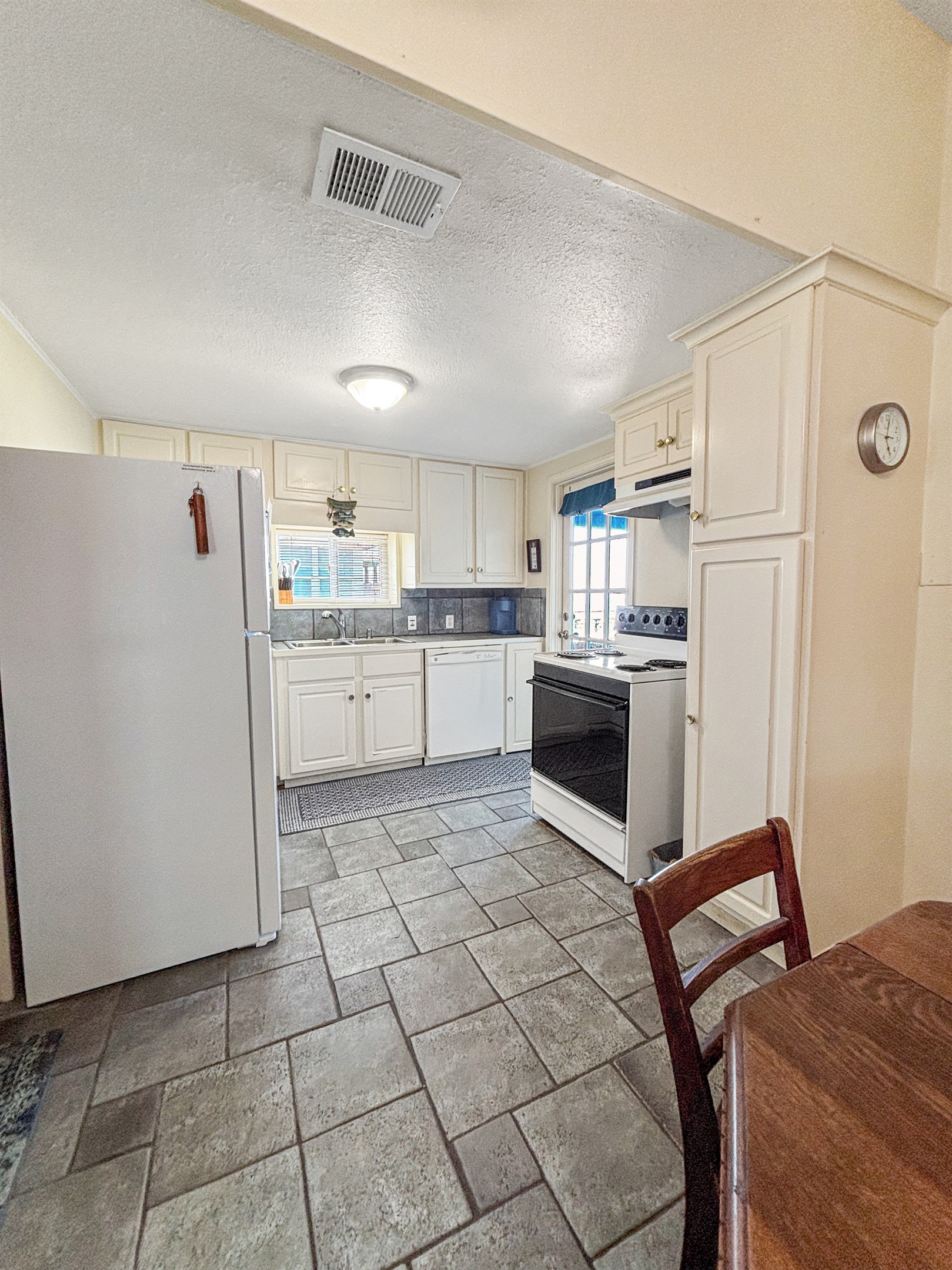Kitchen with access to the upstairs deck
