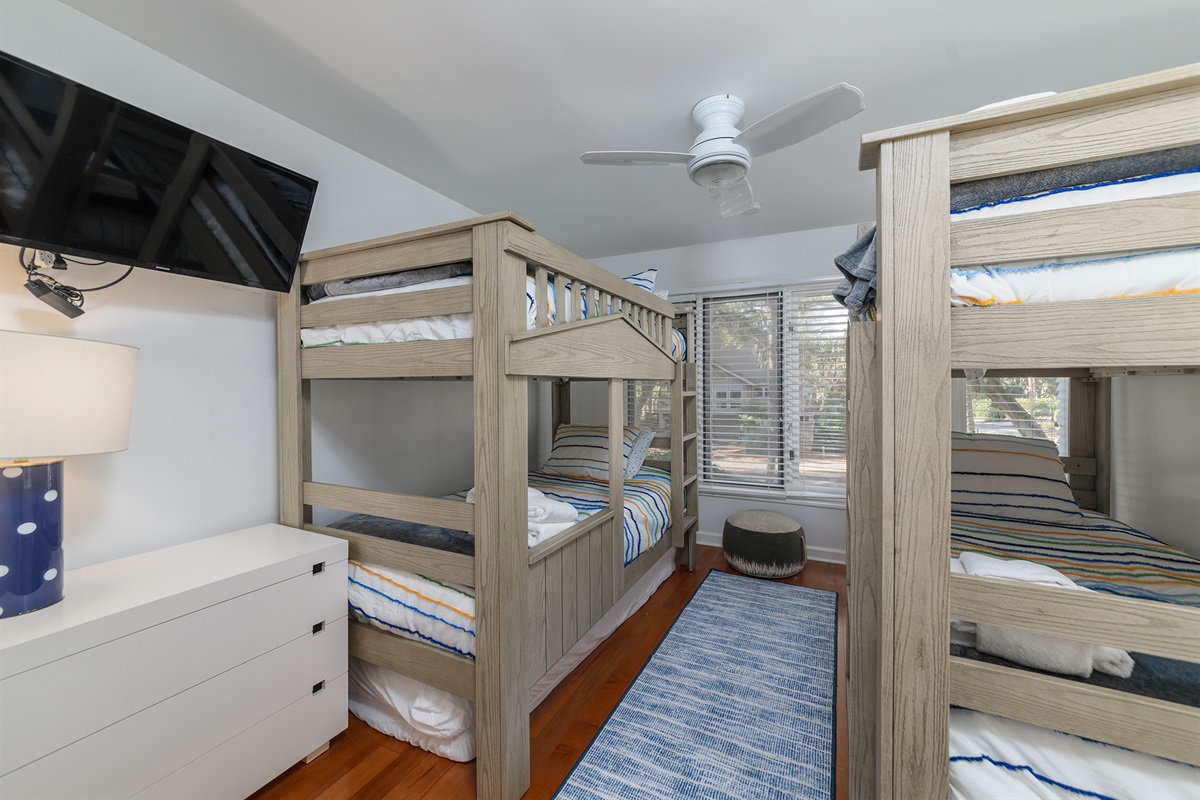 Bunk bedroom on main floor features 4 twins and 1 trundle