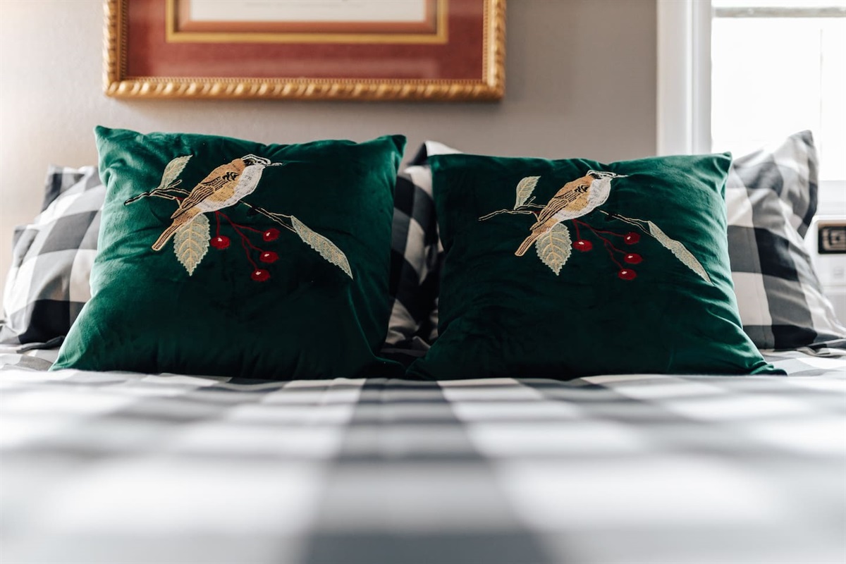 bed room with beautiful linens.