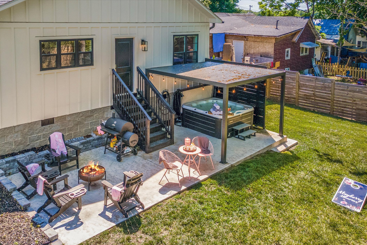 The fenced backyard gives everyone room to relax, play, and spread out.