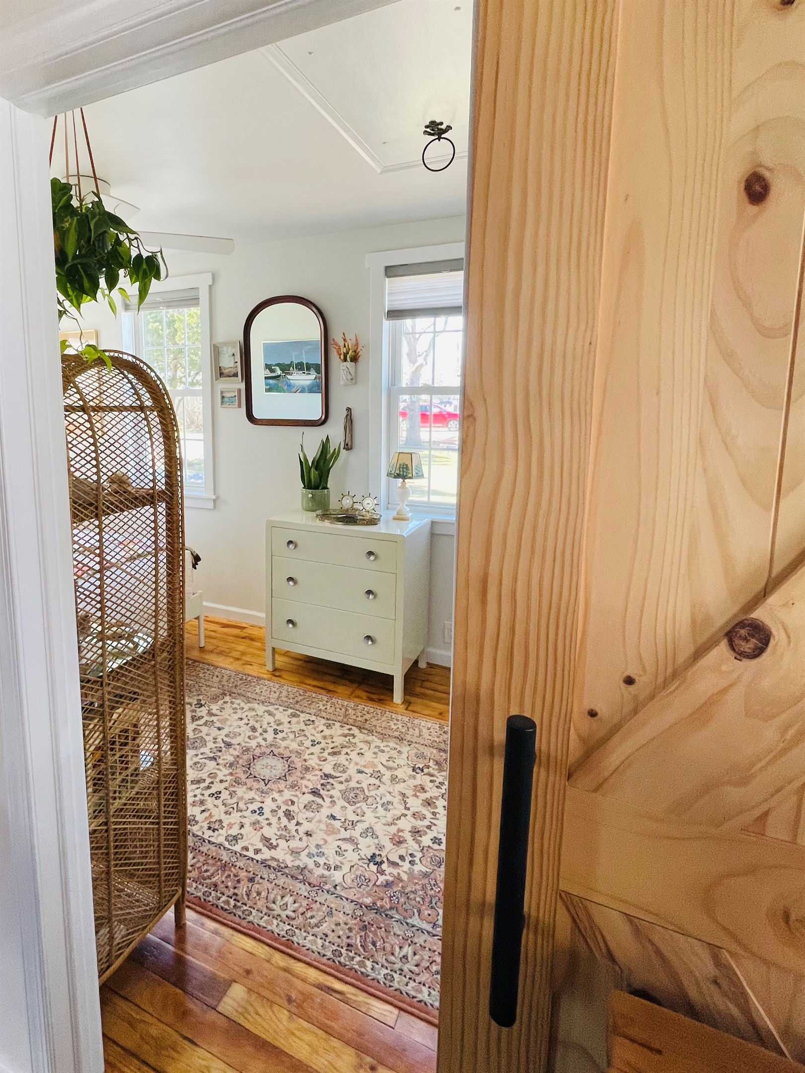 View inside the bedroom from the kitchen. There is a sliding barn door. 