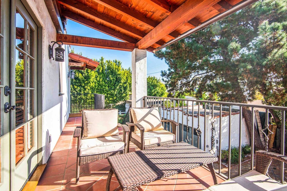 Private terrace with seating off the primary bedroom. 
