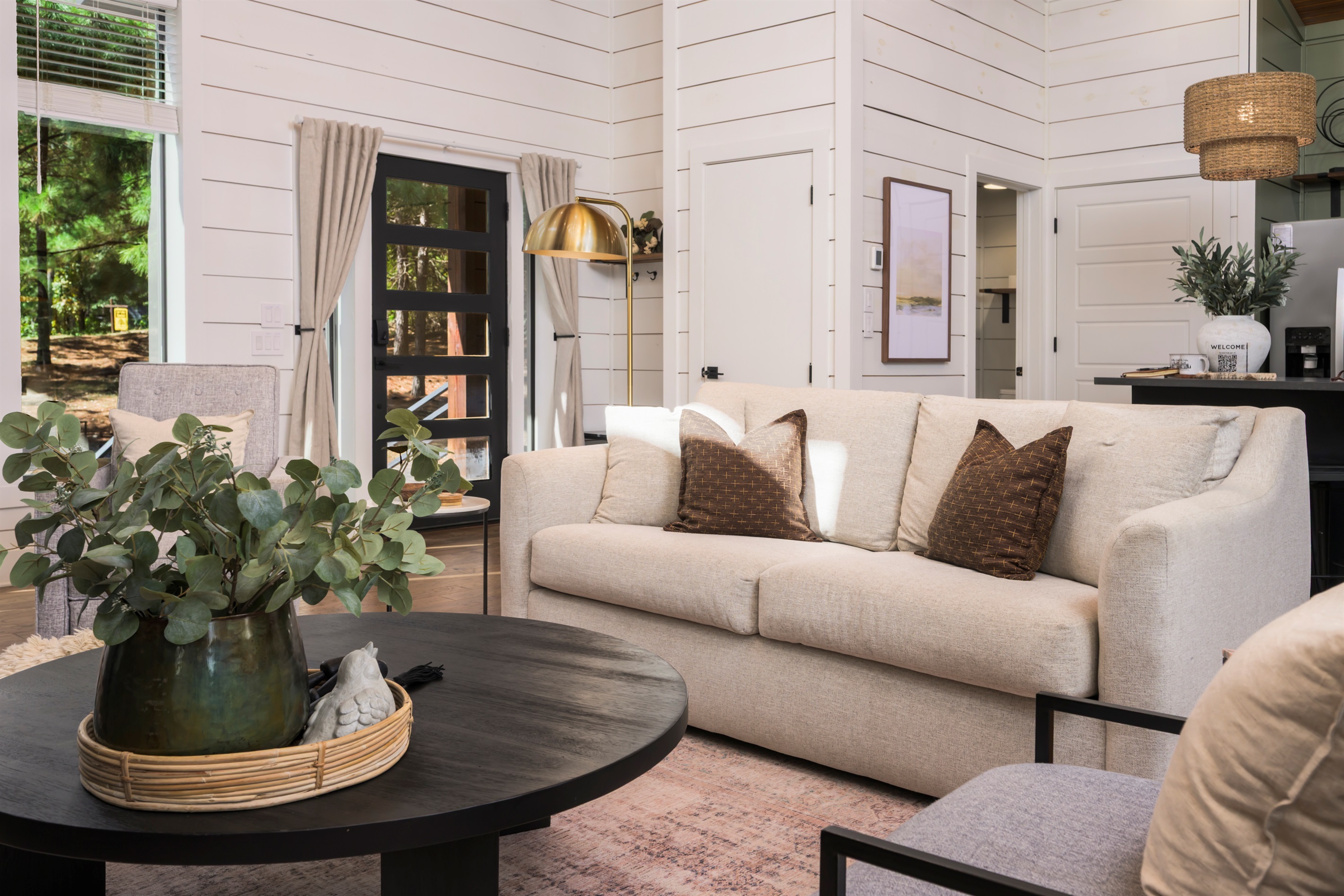 Unwind in a thoughtfully styled living room where modern comfort meets cozy cabin charm