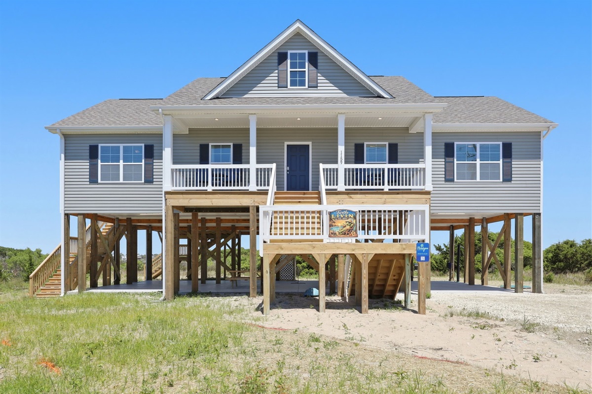 Inviting front porch with seating&mdash;perfect for morning coffee or sunset views