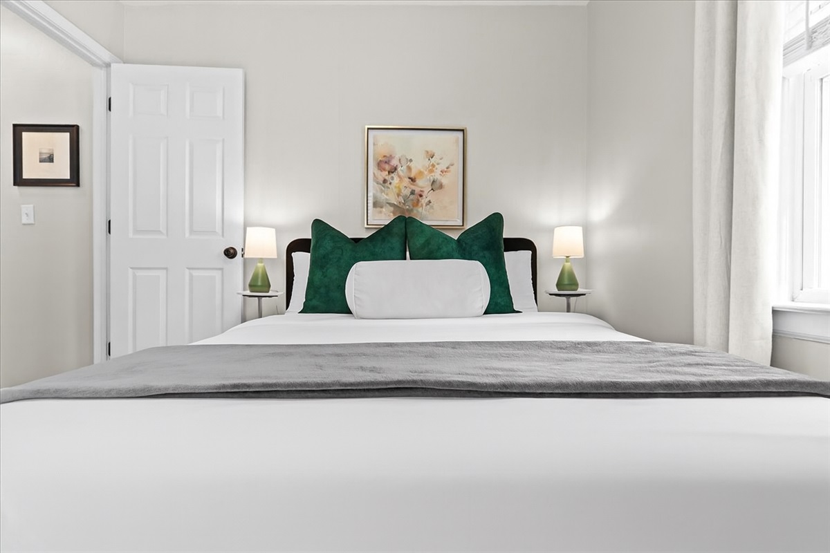 Serene bedroom retreat with plush bedding and calming design