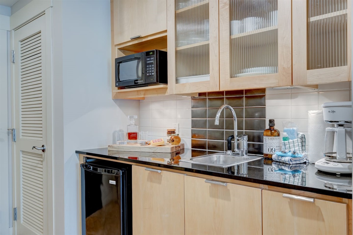 The kitchenette come equipped with a beverage fridge, microwave, both traditional and Keurig coffee makers, drinking glasses, plates, silverware, etc