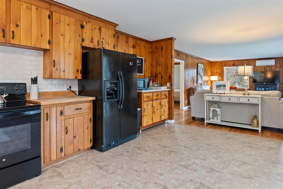 Spacious kitchen extending to the living room