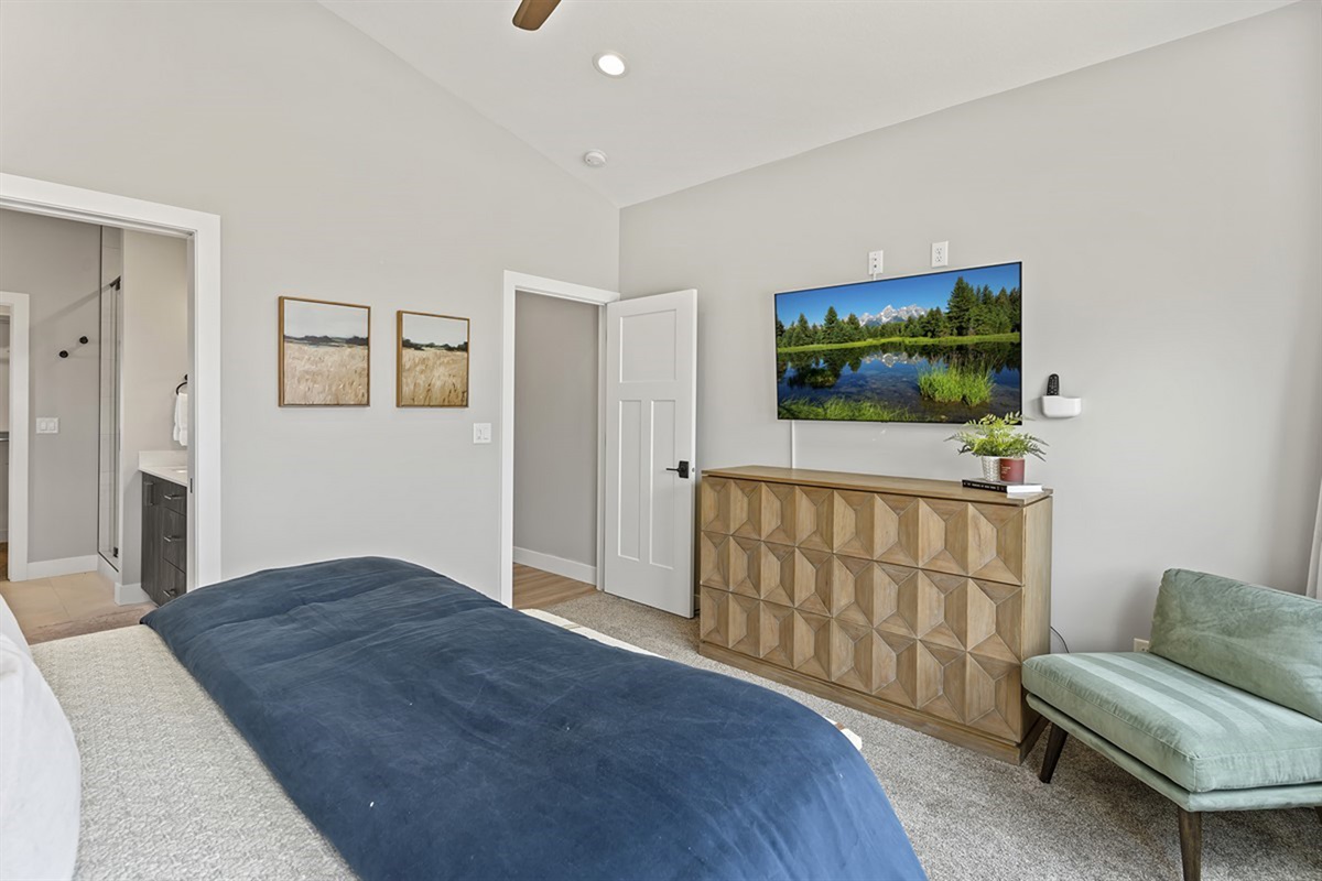 Comfortable bedroom with stylish furnishings and a calming, airy feel