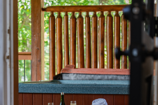 Covered deck hot tub means a relaxing soak no matter what the weather.