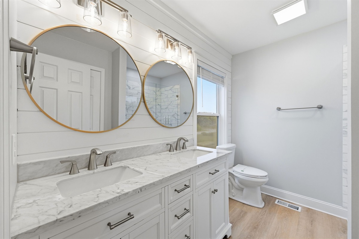 Double vanities and elegant finishes create the perfect getting-ready space